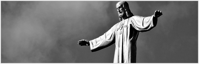 A statue of Jesus with arms outstretched