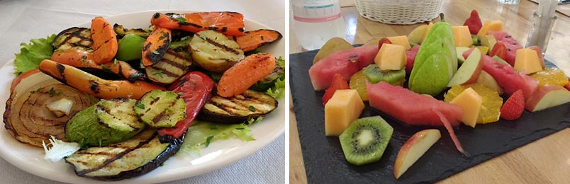 photo of a plate of grilled vegetables and a plate of fresh fruit