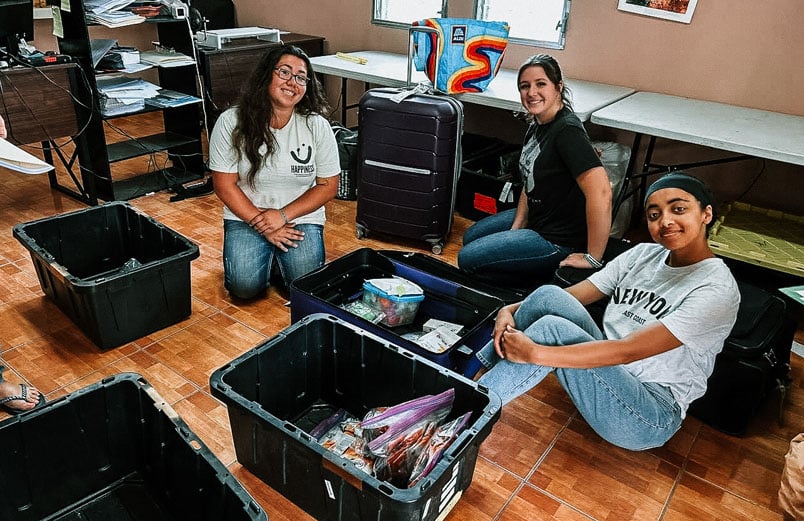 Team members with the suitcases they used to bring supplies for ministry.