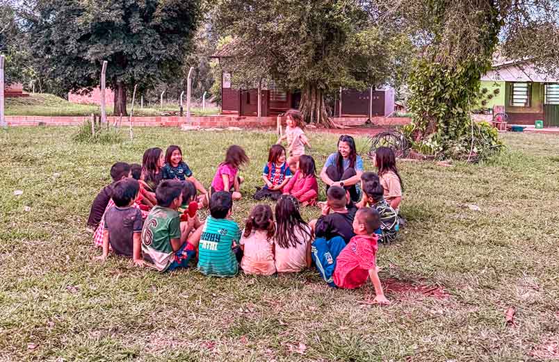 Jina as a missionary spending time with the people of Paraguay.